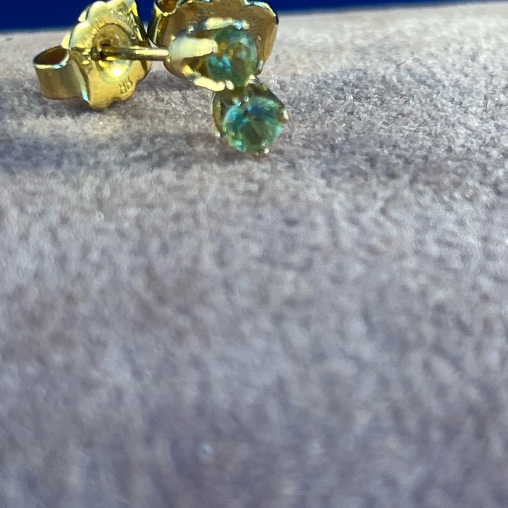 14 kt Gold and Peridot studs.
